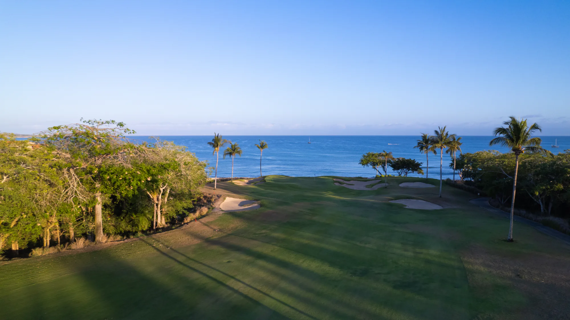 Aerial view of a Punta Mita fairway running toward the Pacific.